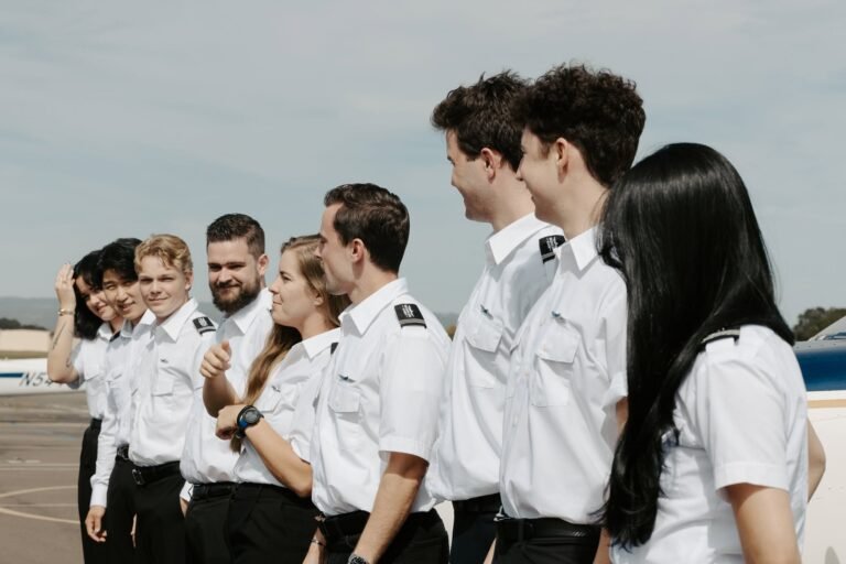 Student pilots standing together at HillsBoro Aero Academy during commercial pilot training